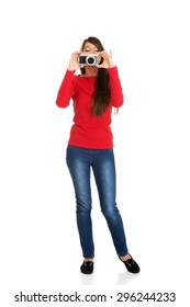 Young Woman Taking A Photo With A Camera.