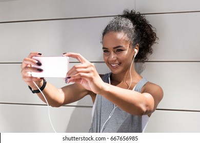 Young Woman Taking A Selfie After Workout, Live Streaming For Social Media