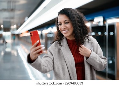 Young Woman Taking A Selfie Standing On A Subway Platform.