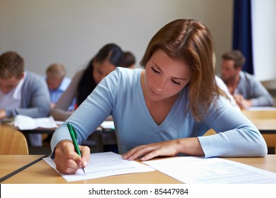 Young woman taking test in job assessment center