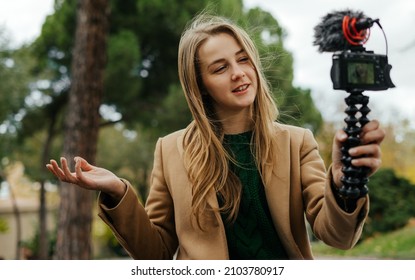 Young Woman Taking Video For Vlog. Female Blogger Influencer Recording Content For Daily Diary On A Street.