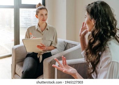 Young Woman Talking About Her Mental Health Problems To The Doctor During Counseling. Mental Health Concept. Selective Focus.