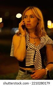 Young Woman Talking On The Phone, Night Walk In The City