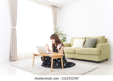 Young woman talking with pc - Shutterstock ID 1111912787