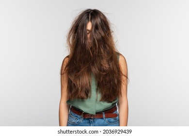 Young Woman With Tangled Long Hair Isolated On Grey