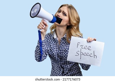 Young Woman With Taped Mouth Trying To Speak Into Megaphone. Free Speech Concept.