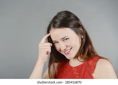 Young Woman Tapping Her Forehead