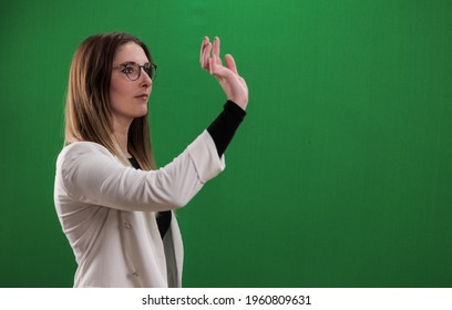 Young Woman Taps On A Large Imaginary Touchscreen - Studio Photography