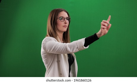 Young Woman Taps On A Large Imaginary Touchscreen - Studio Photography