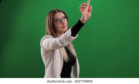 Young Woman Taps On A Large Imaginary Touchscreen - Studio Photography