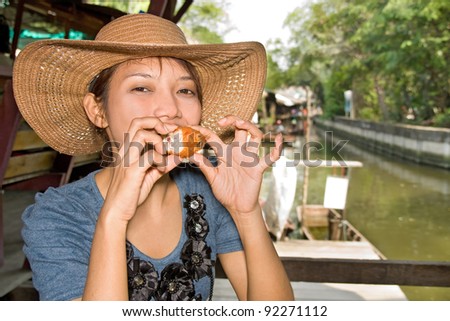 Young woman tasted fried chicken