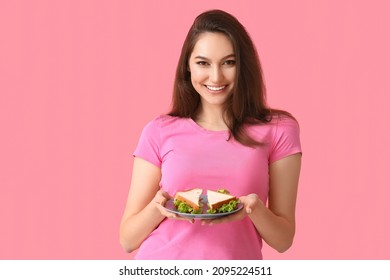 Young Woman With Tasty Sandwich On Color Background