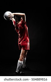 Young Woman Throwing Football