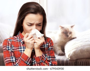 Young Woman With Tissue And Pet On Background. Concept Of Allergies To Cats