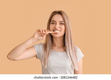 Young woman with tooth brush on color background - Powered by Shutterstock