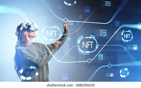 Young woman touch virtual hologram with non-fungible token hud, lines and art image icons. Glowing lines and blocks with nft symbol. Concept of cryptocurrency and marketplace - Powered by Shutterstock