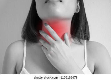 Young Woman Touching Her Neck. Gastro Esophageal Reflux Disease Concept.