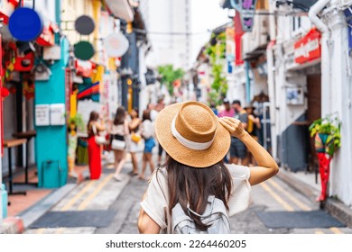 Young woman tourist with backpack walking at Haji Lane in Singapore - Shutterstock ID 2264460205