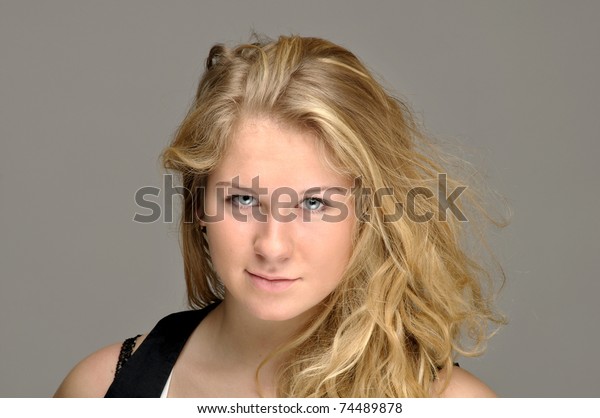 Young Woman Tousled Hair Concentrated Look Stock Photo Edit Now