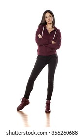 Young Woman In A Track Suit Pants Posing On White Background