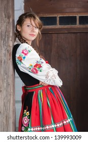 Young Woman In Traditional Polish Costume Or Dress, A Polish Folk Costume.