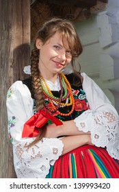 Young Woman In Traditional Polish Costume, A Polish Folk Costume.