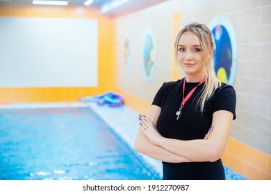 Young woman trainer swimming coach in pool water for children and adults. - Powered by Shutterstock