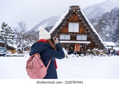 Young woman traveler enjoying with snow at shirakawa-go in winter - Shutterstock ID 2220787441