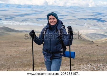 Young Woman Traveler Hiking around Mountains