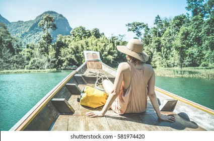 Young Woman Traveler On Longtail Boat Trip At Island Hopping In Cheow Lan Lake - Wanderlust And Travel Concept With Adventure Girl Tourist Wanderer On Excursion In Thailand - Retro Turquoise Filter