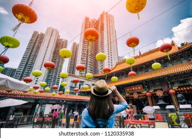 Young woman traveler is visiting at Wong Tai Sin temple in Hong Kong