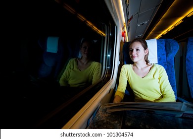 Young Woman Traveling By Train At Night