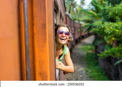 Young Woman Traveling By Train