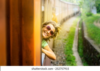 Young Woman Traveling By Train