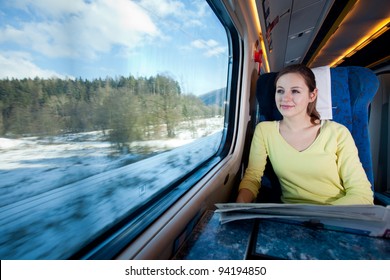 Young Woman Traveling By Train