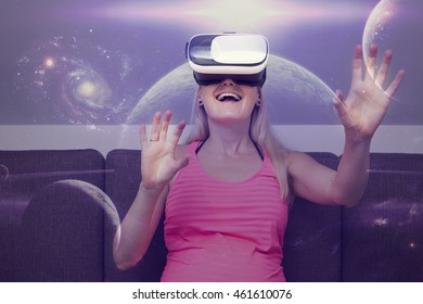 young woman traveling in space using virtual reality glasses - Powered by Shutterstock