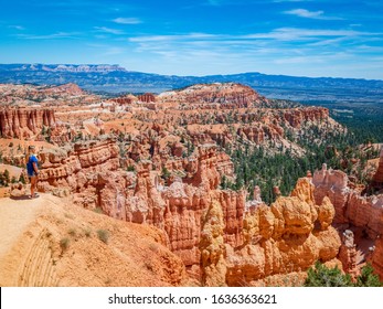 Young Woman Travels Bryce Canyon National Park In Utah, United States, People Travel Explore Nature. Bryce Is A Collection Of Giant Natural Amphitheaters Distinctive Due Hoodoos Geological Structures