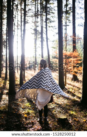 Similar – Image, Stock Photo Young woman with hat taking a walk in the deep forest at sunset.