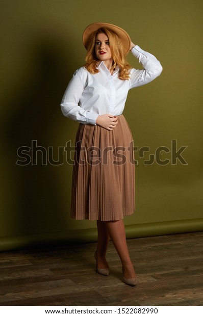 tan skirt and white shirt