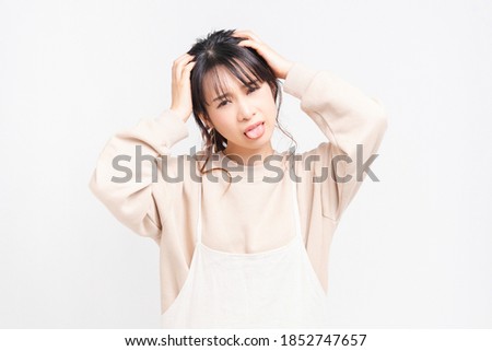 A young woman with troubles shot in the studio