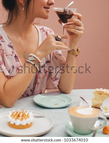 Young woman trying adffogato coffee