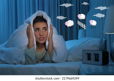 Young woman trying to fall asleep counting sheep in bed at night