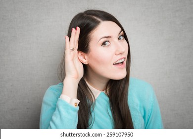 Young Woman Trying To Listen Something