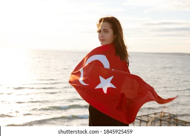 Young Woman With Turkish Flag On Sky Background With Copy Space.