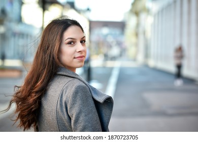 Young Woman Turn Around On Street