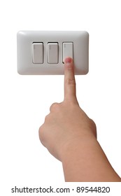 Young Woman Turning Off Light Switch