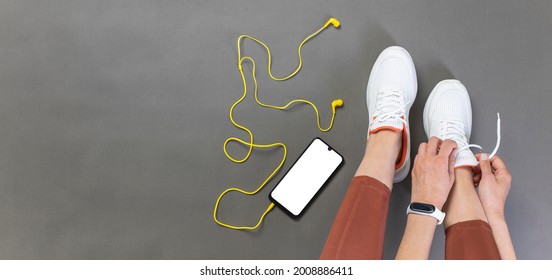 Young Woman Tying Shoelace Before Workout, Getting Ready For Jogging