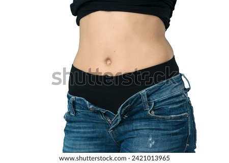 young woman unbuttoning jeans on white background [[stock_photo]] © 