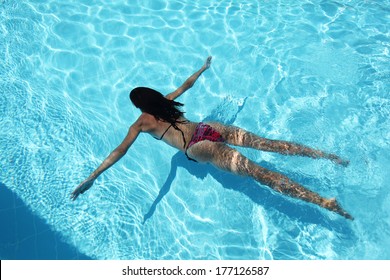 Young Woman Under Water In The Swimming Pool.