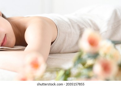 Young woman undergoing esthetic treatment in a massage bed - Shutterstock ID 2035157855